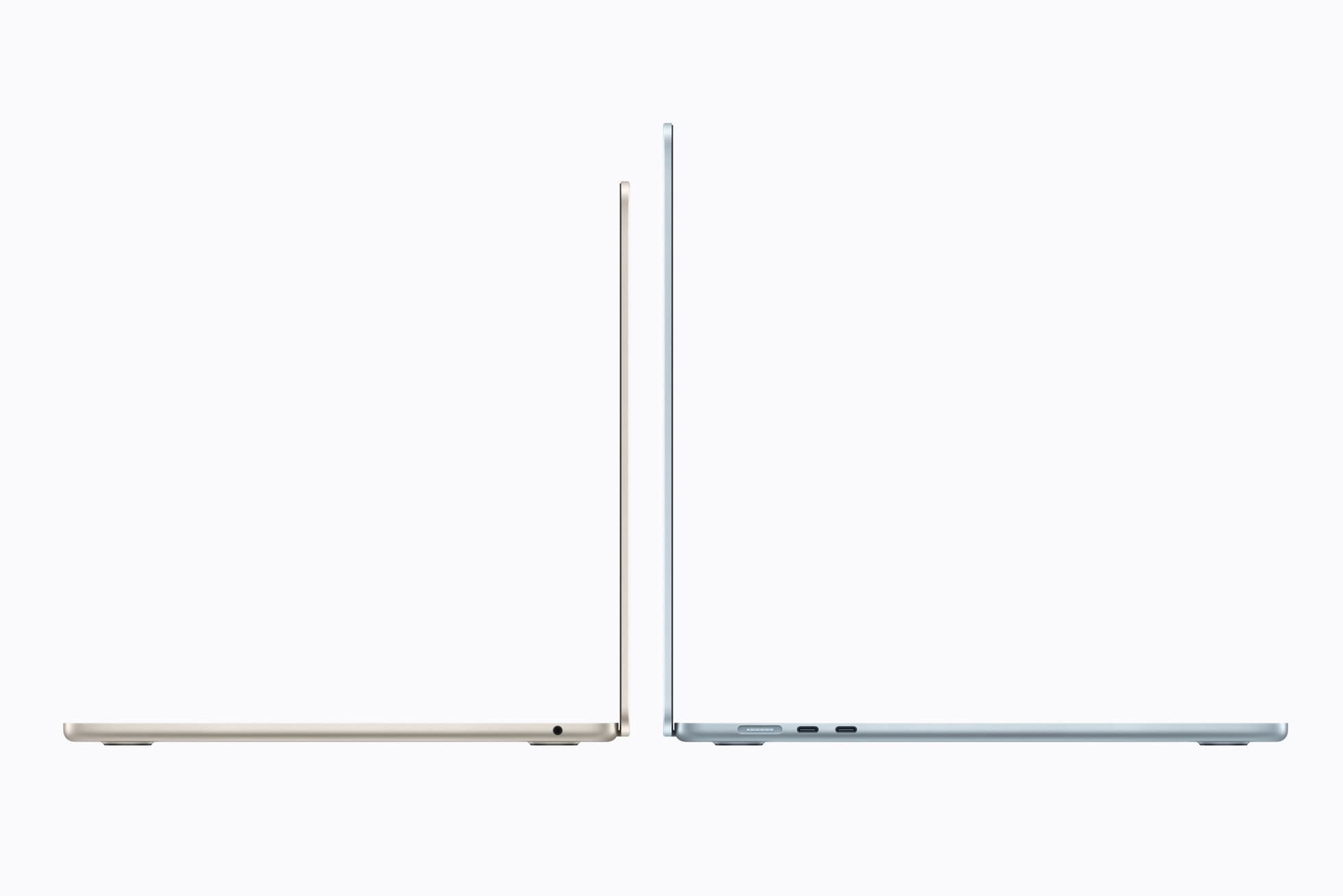 Two MacBook Air laptops stand open and edge-on on a white background: a starlight 13-inch on the left, its lid facing right and a headphone jack on its side, and a sky blue 15-inch on the right, its lid facing left, with a MagSafe port and two USB-C ports showing.